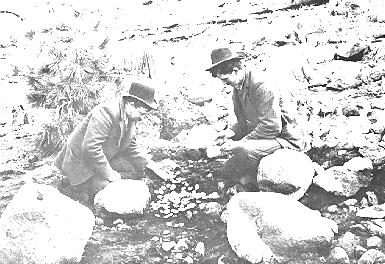 Old photograph of miners with coins